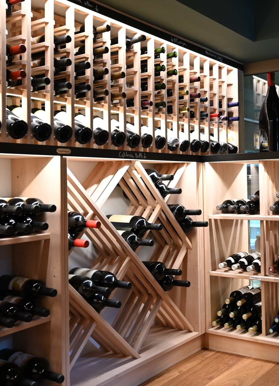 Wine room at il punto with bottles in wooden racks